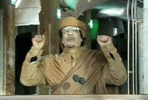 Gaddafi makes surprise appearance as protests continue