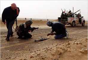 Battle in Libya for strategic town kills at least 13