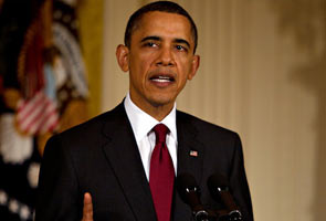 Stop attacks on civilians or face military action, Obama warns Gaddafi