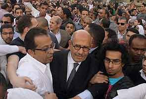 El Baradei attacked; flees without voting