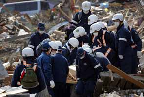 Japan: Bodies wash in, dashing hopes of survivors