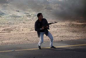 Rebels in Libya win battle but fail to loosen Gaddafi's Grip