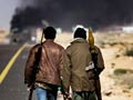 Libyan rebels flee strategic town under heavy attack