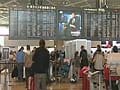 Tokyo airports packed as passengers queue to leave Japan