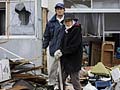 Careful search for mementos slows Japan rebuilding