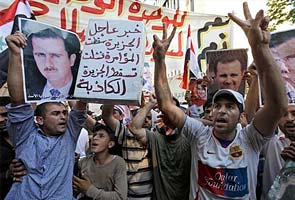15 die as Syrians march demanding Assad's ouster