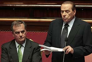 Berlusconi wins in parliament after losses