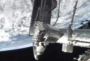 Space shuttle Atlantis docks with International Space Station for the last time