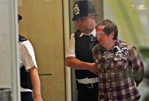 Man who attacked Murdoch charged by UK police