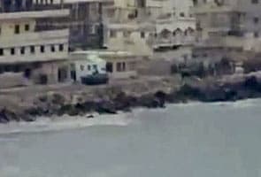 Syrian gunboats fire on coastal city, 25 killed
