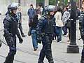 Britain riots: London calmer, violence spreads to more cities