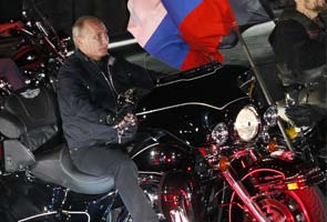 Putin rides on a Harley to impress Russian youths 