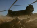 NATO, Afghan forces fight insurgents near chopper crash site