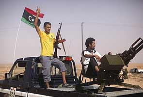 Libyan fighters say Gaddafi surrounded