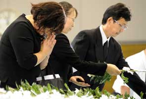 Silence as Japan marks six months after tsunami