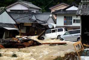 Typhoon dumps record rain on Japan, killing 25 