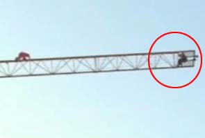 Man climbs on a crane to commit suicide