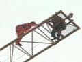 Man climbs on a crane to commit suicide