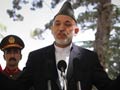 Afghanistan President Hamid Karzai arrives in India