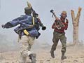 Libyan fighters assault main Gaddafi base in Sirte