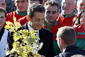 Proud papa Sarkozy says wife, baby 'very well'