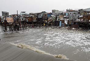 Typhoons in Philippines leave 55 people dead, trapped on roofs
