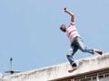 Jilted lover jumps off 5-storey house as cops, crowd watch