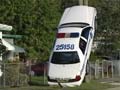 Florida cop 'parks' his car up a light pole