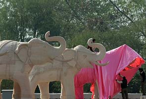 With just one day to go, covering up statues of Mayawati, elephant begins
