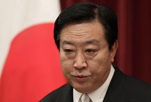 Japan's Prime Minister reshuffles cabinet in bid to win tax support 