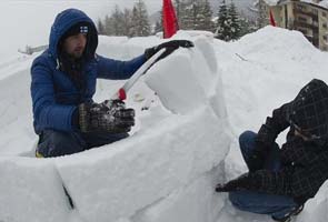 Occupy Wall Steet protesters build igloos in Switzerland to protest economic summit