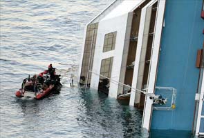 Italian divers find 12th body as search of cruise ship resumes