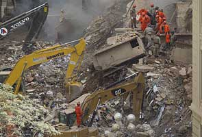 Buildings collapse in Rio, three dead