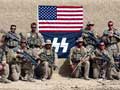 Marines posed with logo resembling Nazi symbol