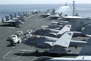 Iranian boats shadow US aircraft carrier in Gulf