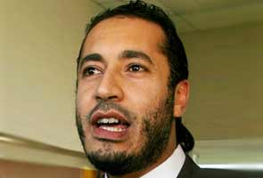 Gaddafi's son promises to return to Libya: media