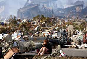 One year on, 'ghosts' stalk Japan's tsunami city