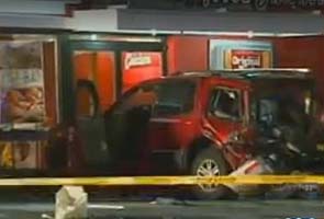 One dead after BMW crashes through restaurant window 