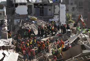 Death toll in Pakistan factory collapse up to 18 