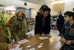 Iran elections: Ahmadinejad rivals leading in parliament vote