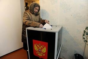 Polls open in Russia as Putin seeks return to presidency