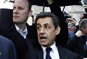 French President Nicolas Sarkozy holes up in bar to escape protesters