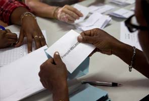 Voting begins in France, economy may doom Sarkozy