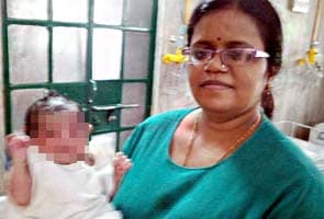 Baby girl lies unwanted as two families battle over a new-born boy