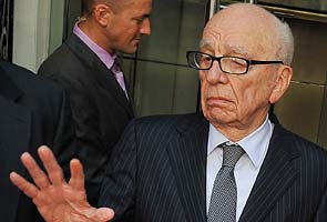 Rupert Murdoch mocks UK government as he arrives for ethics inquiry