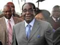 'Fit as a fiddle' Mugabe back home from Singapore