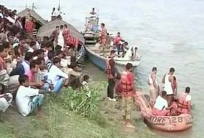 Assam boat tragedy: Families wait in torrential rain for news of missing members