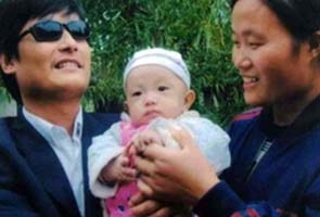 Blind Chinese activist wants to leave China, fears for family's safety