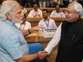 Controversy over Nitish handshake with Modi