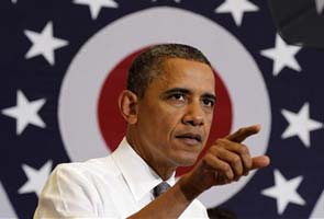 Barack Obama hits Mitt Romney's record as governor 